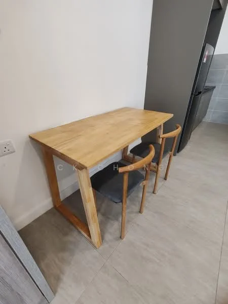 Room features: wooden dining table, 2 wooden chairs, grey tiled flooring, white painted walls, kitchen cabinetry in background, refrigerator visible, open space layout; style: modern.
