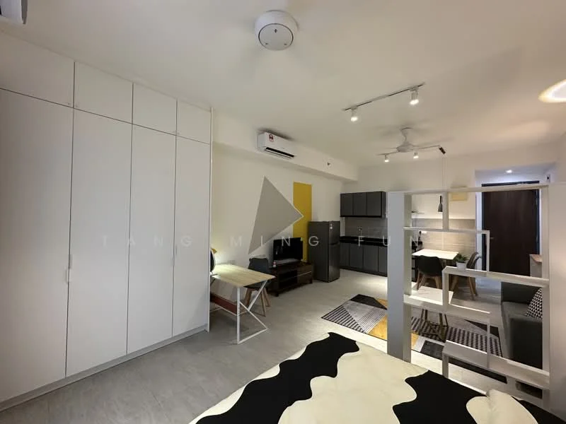 Room features: light grey tiled flooring, white painted walls, ceiling with recessed lighting, 1 wall-mounted split AC, 5-blade ceiling fan, built-in wardrobe with sliding doors, kitchenette with grey cabinetry, stainless-steel fridge, black countertop, open shelving, dining table with white legs, area rug with geometric pattern, black and white bedding, decorative wall art; style: modern.
