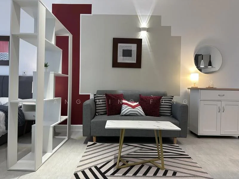 Living features: grey fabric sofa, red accent cushions, white coffee table with gold legs, area rug with geometric pattern, white open shelving unit, wall-mounted light fixture, framed artwork on wall, wooden sideboard, decorative mirror; style: modern.