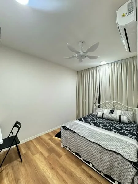 Bedroom features: queen-size bed with patterned bedding, upholstered headboard, black and white decorative pillows, wooden flooring, 5-blade ceiling fan with light, floor-to-ceiling curtains, window with sheer curtains, study desk with black chair, wall-mounted air conditioning unit; style: modern.