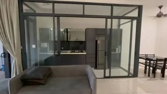 Living features: grey fabric sofa, glass partition wall, ceiling fan, tile flooring, neutral wall colour, dining table with chairs, open layout to kitchen, large windows, curtains; style: modern. Kitchen features: black cabinetry, white countertop, stainless-steel fridge, built-in oven, gas hob, extraction hood, kitchen sink, tile backsplash; style: modern.