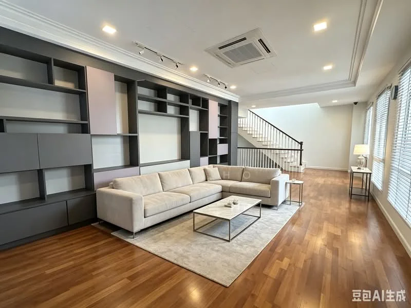 Living features: 3-seater fabric sofa in light grey, coffee table with metal frame, area rug with neutral color, built-in shelving unit with grey and pink accents, wooden flooring, recessed downlights, ceiling-mounted air conditioning unit, large windows with blinds, staircase in background; style: modern.