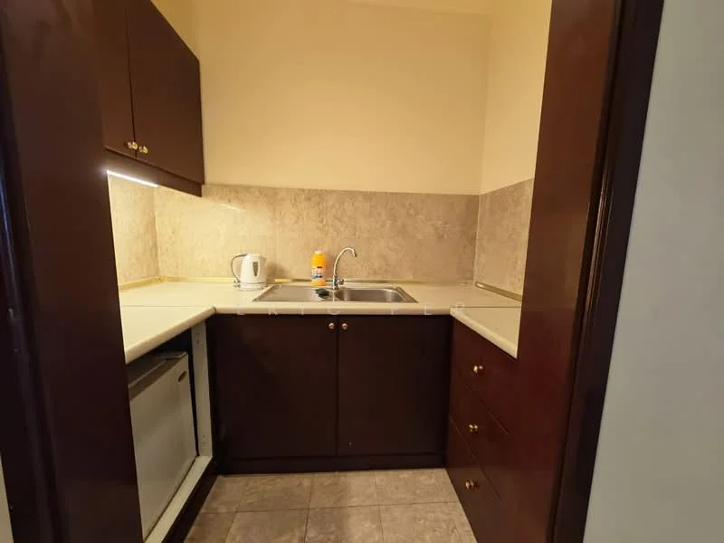 Kitchen features: double-bowl stainless-steel sink, chrome pull-down faucet, laminate countertop, brown wooden cabinetry, built-in refrigerator, kettle, grey tiled backsplash, grey floor tiles, under-cabinet lighting; style: modern.