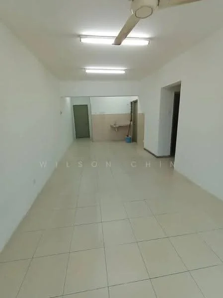 Room features: white painted walls, tile flooring, fluorescent ceiling lights, ceiling fan, kitchenette area with sink, open layout, neutral color scheme, no visible furniture; style: minimalist.
