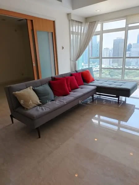 Living features: 3-seater fabric sofa in grey, decorative cushions in red and beige, marble tile flooring, floor-to-ceiling windows, sheer curtains, city skyline view, coffee table, area rug; style: modern; view: city.