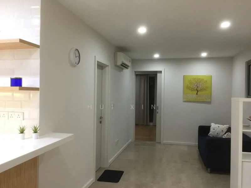 Room features: white painted walls, recessed LED downlights, wall-mounted split AC, light-colored flooring, clock on wall, decorative artwork, open shelving, sofa with cushions; style: modern.