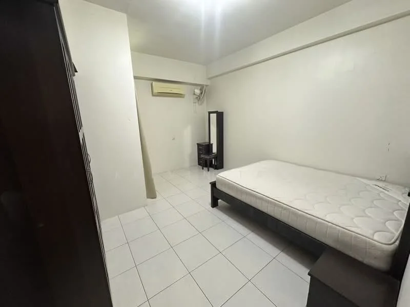 Bedroom features: white painted walls, white tiled flooring, single bed frame, mattress without bedding, 1 bedside table, 1 tall dresser, 1 full-length mirror, 1 wall-mounted split AC.