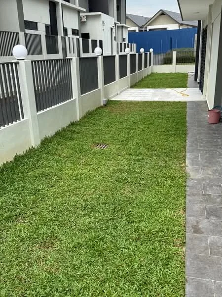 Exterior type: linked terrace house; features: manicured lawn, concrete pathway, white painted fence, black metal railing, outdoor lighting fixtures, drainage grate, landscaped garden area; style: modern.
