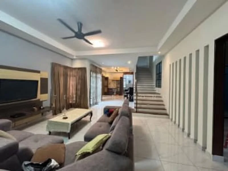Living features: large grey sectional sofa, coffee table, wall-mounted TV, 5-blade ceiling fan with light, cream painted walls, tile flooring, curtains, decorative wall panels, staircase in background, open layout to dining area; style: modern.