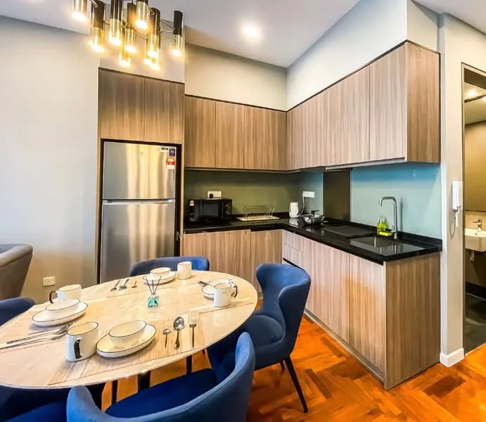 Kitchen features: stainless-steel fridge, black granite countertop, wood cabinetry, microwave, built-in oven, kitchen sink with faucet, ceramic tile backsplash, pendant lighting, dining table with 6 blue upholstered chairs, wood flooring, open layout, recessed lighting; style: modern.