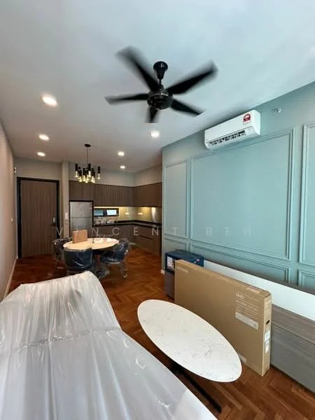 Living features: 5-blade ceiling fan with light, wall-mounted split AC, wooden flooring, light grey painted walls, recessed downlights, dining table, white marble coffee table, sofa covered in plastic, kitchen cabinetry, open layout, decorative wall paneling, box of appliances, door to hallway; style: modern.