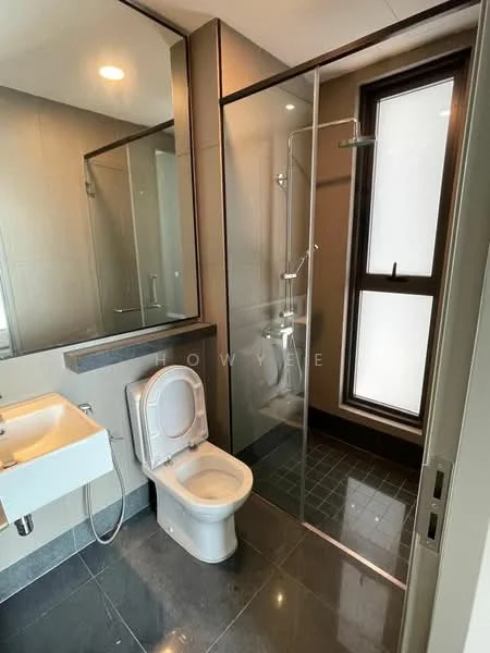 Bathroom features: glass shower enclosure, rain shower head, handheld shower, white toilet, single-sink vanity with wall-mounted cabinet, mirror above sink, grey tiled walls, black floor tiles, window for natural light, chrome faucet; style: modern.