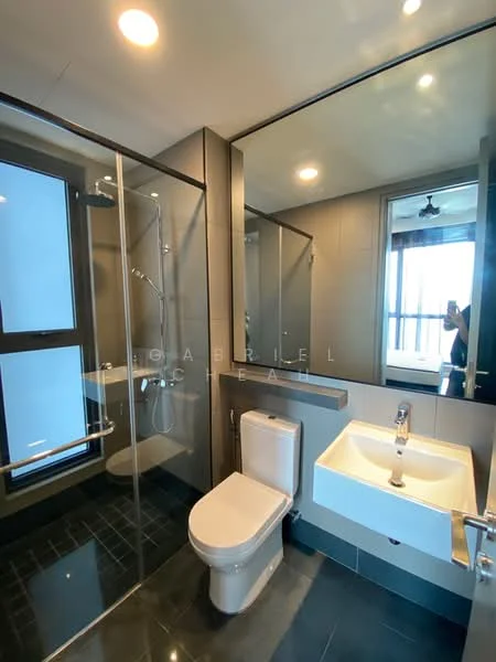 Bathroom features: glass shower enclosure, rain shower head, handheld shower, single-sink vanity with white cabinet, chrome basin mixer, framed mirror, one-piece toilet, black tile flooring, grey wall tiles, recessed downlights, window with city view, sliding glass door; style: modern; view: city.
