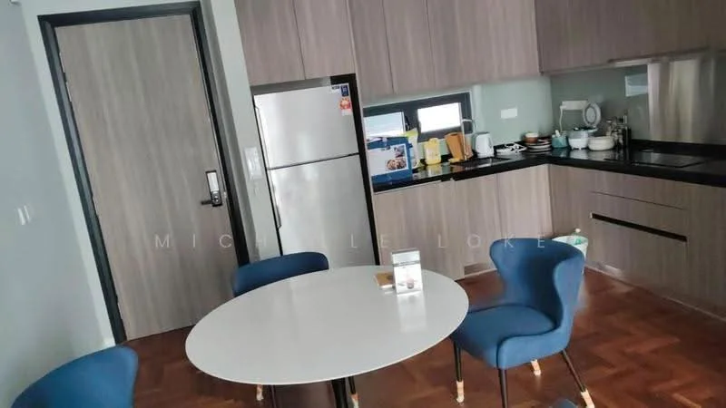 Kitchen features: grey cabinetry, black countertop, stainless-steel fridge, built-in sink, kitchen utensils on countertop, wall-mounted window, wooden flooring, round white dining table, blue upholstered dining chairs; style: modern.