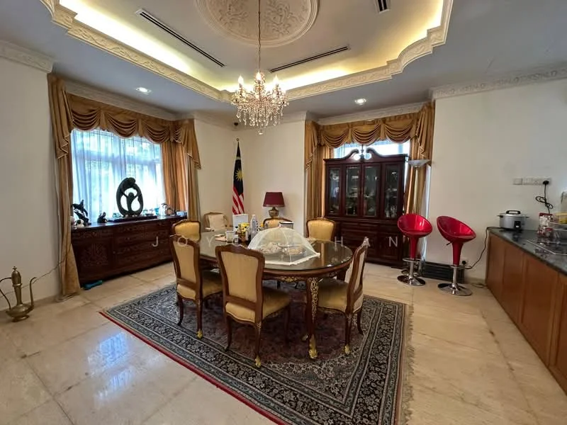 Dining features: round dining table with glass top, 8 upholstered dining chairs in gold, chandelier with decorative design, cream painted walls, crown moulding on ceiling, floor-to-ceiling windows with sheer curtains, wooden sideboard with decorative items, traditional area rug with intricate pattern, wooden cabinetry with glass display, red bar stools at counter, marble flooring; style: traditional.