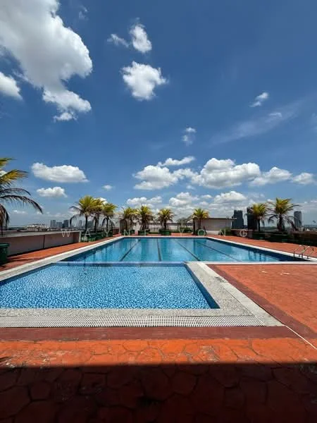 Exterior type: swimming pool deck; features: infinity pool, lap pool, pool deck with loungers, tropical landscaping with palm trees, red brick paving, blue mosaic tile pool, surrounding city skyline view, clear blue sky with clouds; style: modern.