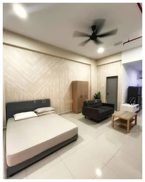 Bedroom features: queen-size bed, upholstered headboard, 2 bedside lamps, sofa in dark grey fabric, coffee table in light wood, built-in wardrobe with sliding doors, wall-mounted ceiling fan, light-colored walls with wood paneling, glossy tile flooring, recessed lighting, window with no visible treatment, kitchenette area with fridge; style: modern.
