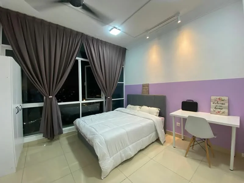 Bedroom features: queen-size bed with white bedding, grey upholstered headboard, white bedside table, white chair, purple accent wall, white painted walls, floor-to-ceiling windows, dark grey curtains, ceiling fan, tile flooring, decorative wall art, desk lamp; style: modern; view: city.