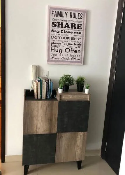Room features: wooden cabinet with two-tone finish, decorative wall art with family rules, small potted plants, books on shelf, neutral wall color, tile flooring; style: modern.