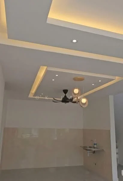Room features: white painted walls, polished concrete flooring, tray ceiling with recessed lighting, 5-blade ceiling fan with light, pendant light fixtures, wall-mounted sink, water bottle on sink, neutral color palette; style: modern.