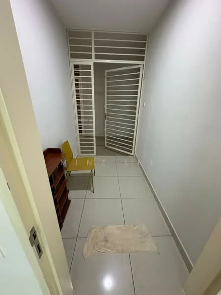 Room features: white painted walls, grey tiled flooring, sliding glass door, metal grille door, wooden shelving unit, single yellow chair, small area rug.
