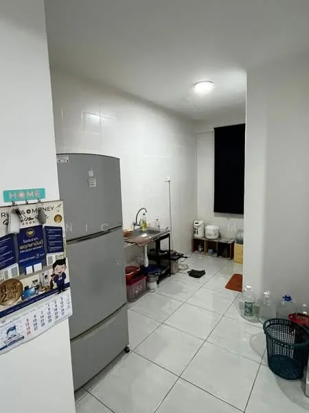 Kitchen features: grey refrigerator, single-bowl stainless-steel sink, chrome faucet, white tiled walls, white tiled flooring, wooden countertop, black window with no treatments, plastic storage containers, baskets, water bottles.