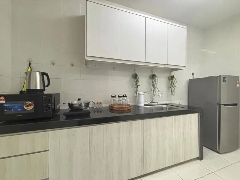 Kitchen features: white cabinets with flat-panel design, black countertop, stainless-steel fridge, stainless-steel kettle, microwave, cooking pot, glass canisters, sink with faucet, white tiled walls, ceramic tile flooring, hanging plants; style: modern.