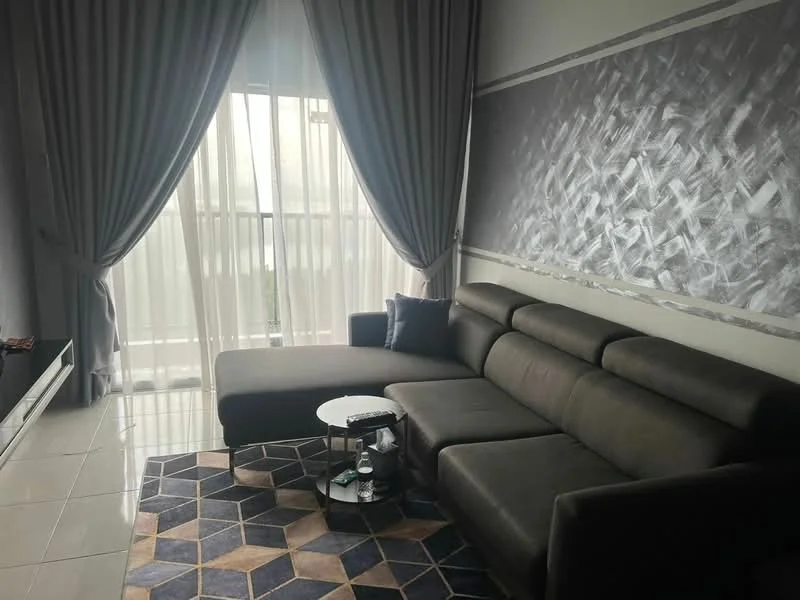 Living features: L-shape sectional sofa in dark grey, round coffee table, area rug with geometric pattern, floor-to-ceiling sheer curtains, grey accent wall with textured design, white painted walls, sliding glass door, natural light from window; style: modern.