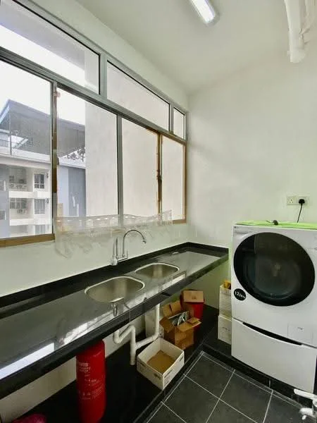 Laundry features: double-bowl stainless-steel sink, black granite countertop, white front-load washing machine, grey tiled flooring, large window with natural light, white painted walls, fire extinguisher, cardboard boxes.