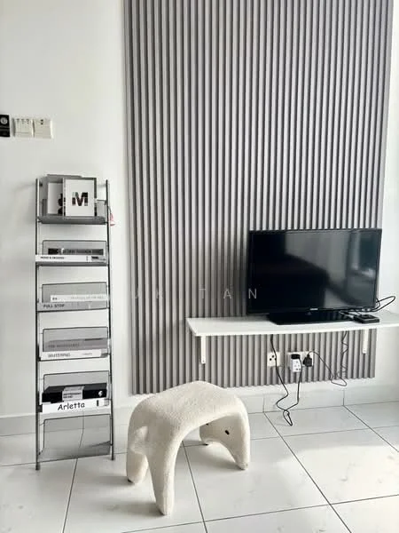 Living features: grey accent wall with vertical paneling, white walls, white tiled flooring, wall-mounted TV, floating white shelf, metal shelving unit, decorative storage boxes, textured stool; style: modern.