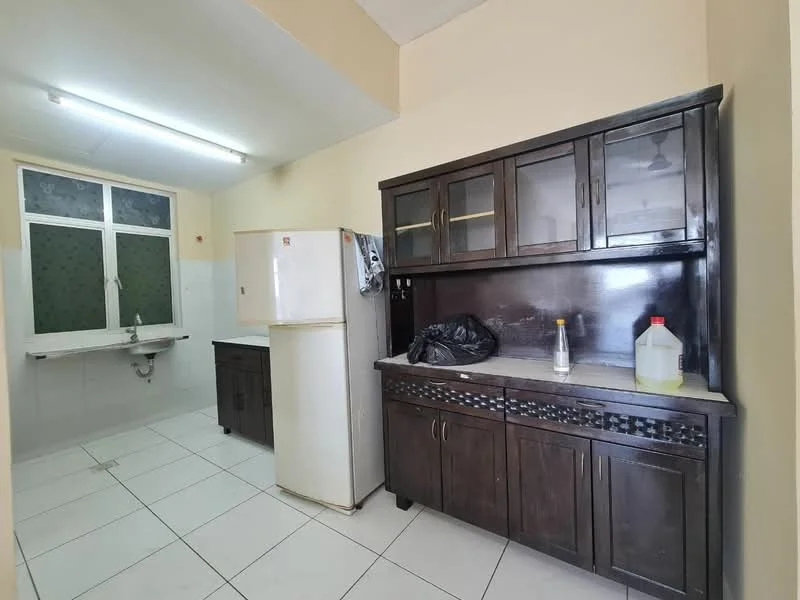 Kitchen features: white tiled flooring, cream painted walls, single-bowl stainless-steel sink, white refrigerator, dark wood cabinetry, countertop with grey surface, wall-mounted cabinet with glass doors, window with green patterned treatment, kitchen countertop with backsplash, built-in wall shelf.