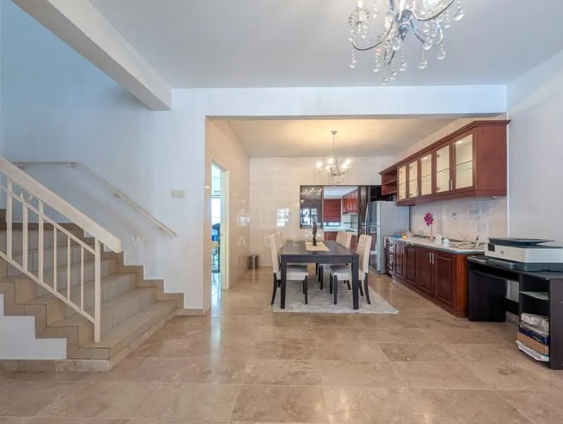 Dining features: marble tile flooring, white painted walls, chandelier, dining table with 6 chairs, built-in wooden cabinetry, stainless-steel fridge, built-in oven, microwave, kitchen island, open layout to kitchen, sliding glass door, staircase with white railing; style: modern.