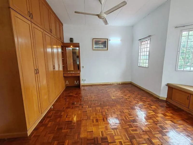 Bedroom features: parquet wood flooring, white painted walls, built-in wooden wardrobe, wooden bench, ceiling fan, two windows with grilles, framed artwork, natural light from windows.