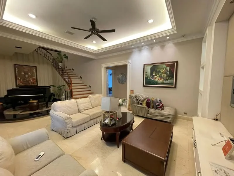 Living features: cream fabric sofa, 3-seater sofa, 2-seater sofa, wood coffee table, area rug, ceiling fan with light, recessed lighting, wall-mounted TV, decorative artwork, potted plants, staircase in background, marble flooring, white painted walls, built-in shelving unit; style: contemporary.