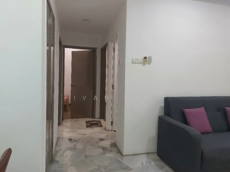 Living features: grey fabric sofa, purple accent pillows, marble flooring, white painted walls, recessed lighting, doorway leading to hallway, doorway leading to other rooms; style: modern. Hallway features: white painted walls, marble flooring, doorways to multiple rooms.