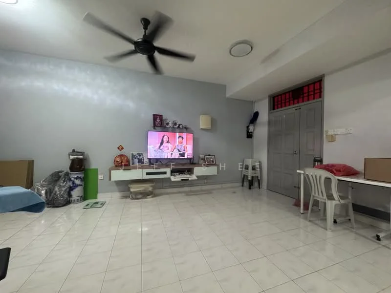 Living features: white painted walls, glossy white tile flooring, 5-blade ceiling fan, wall-mounted TV, TV console, decorative wall shelf, plastic dining chairs, dining table, cardboard boxes, green water dispenser, light fixture on ceiling, door with grille, window with sheer curtains; style: modern.