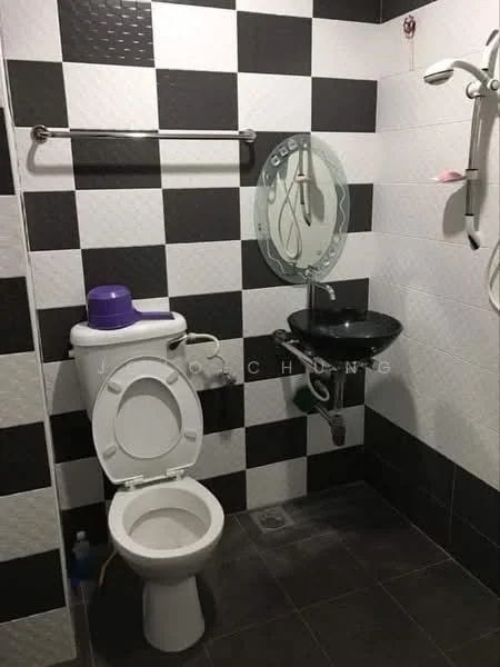 Bathroom features: black and white checkered wall tiles, black floor tiles, one-piece toilet, chrome towel rail, black sink with wall-mounted faucet, shower with handheld shower head, mirror with circular frame, soap holder, toilet paper holder; style: modern.