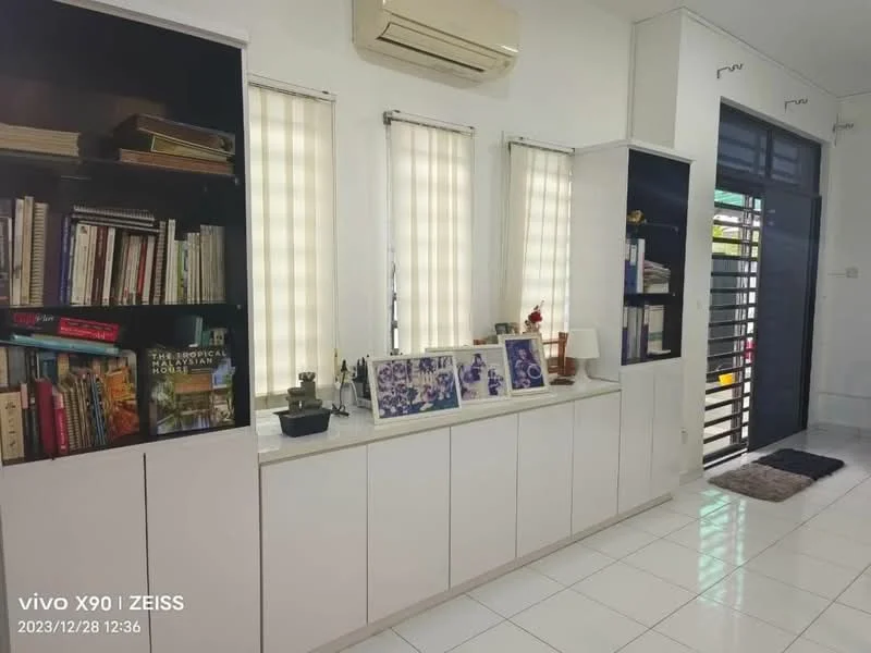 Room features: white painted walls, glossy white tile flooring, built-in cabinetry with white finish, bookshelves with books and decor, framed photographs on display, air conditioning unit on wall, vertical blinds on windows, door leading to exterior, rug at entrance; style: modern.