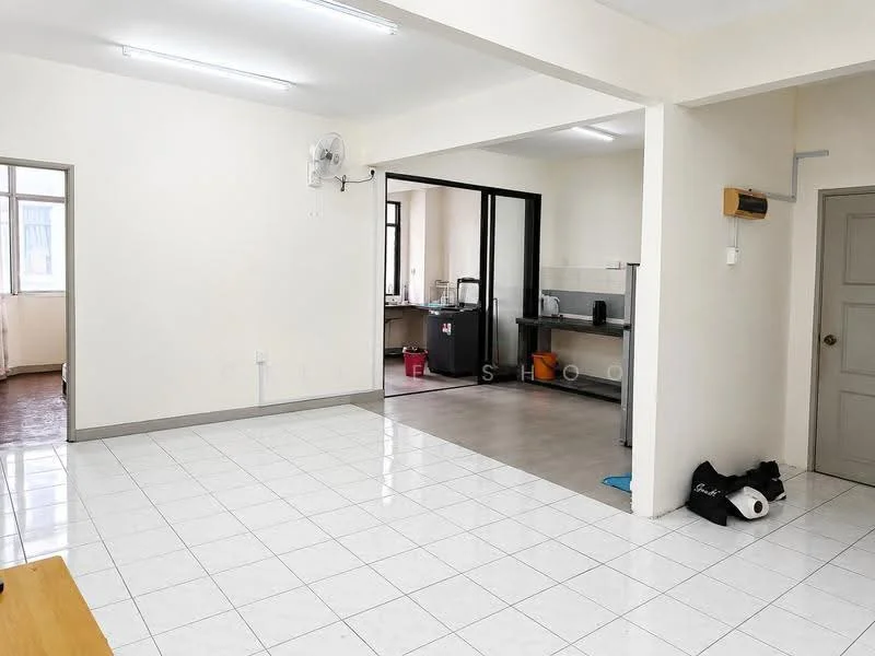 Living features: white painted walls, glossy white tile flooring, ceiling lights, wall-mounted split AC, open layout to kitchen, large windows, neutral decor, space for furniture arrangement. Kitchen features: grey tile flooring, white cabinetry, stainless-steel sink, countertop space, kitchen appliances visible, open layout to living area, window for natural light.