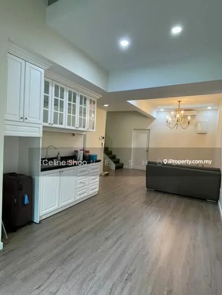 Living features: laminate flooring, white cabinetry with glass-front upper cabinets, black countertop, recessed downlights, chandelier, sofa in grey, staircase leading to upper level, wall with door leading to other rooms, large open space; style: modern.