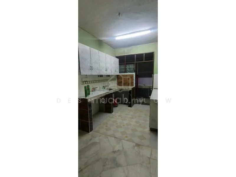 Kitchen features: white cabinets with silver handles, grey countertop, double-bowl stainless-steel sink, chrome faucet, built-in oven, freestanding refrigerator, tile flooring, green painted walls, window with metal grille, light fixture on ceiling, open shelving, decorative tiles with geometric pattern.