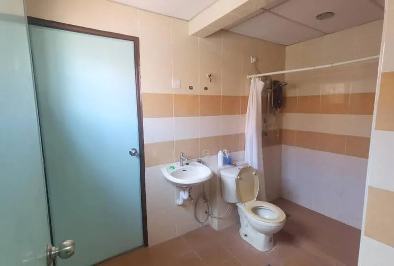Bathroom features: white tiled walls, beige accent tiles, ceramic tile flooring, single-sink vanity with white cabinet, chrome basin mixer faucet, toilet, shower curtain rod, shower area, mirror above sink.