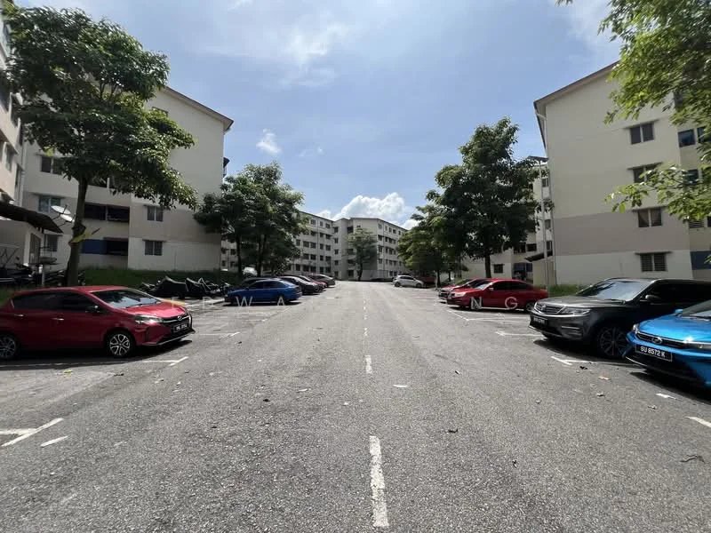 Exterior type: low-rise apartment block; features: 2-storey low-rise buildings, asphalt road, parking spaces, mature trees lining the street, surrounding greenery, clear blue sky; style: modern.