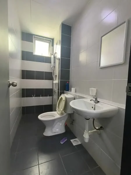 Bathroom features: white toilet, single-sink vanity with wall-mounted faucet, mirror above sink, shower with wall-mounted showerhead, grey and white tiled walls, dark grey floor tiles, window for natural light, toilet paper holder, soap dispenser, shower curtain rod; style: modern.