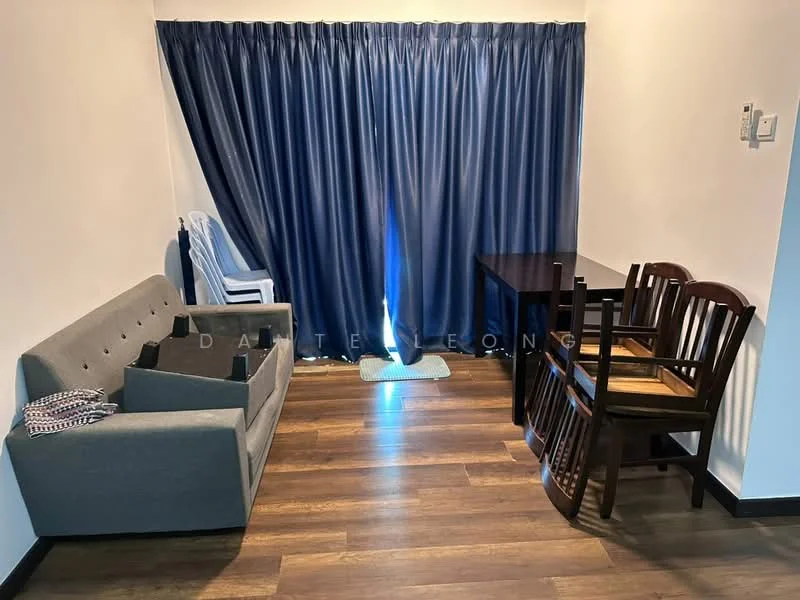 Living features: grey fabric sofa, wooden dining table, four wooden dining chairs, dark wood flooring, blue curtain, light source from window, plastic chair, decorative throw blanket.