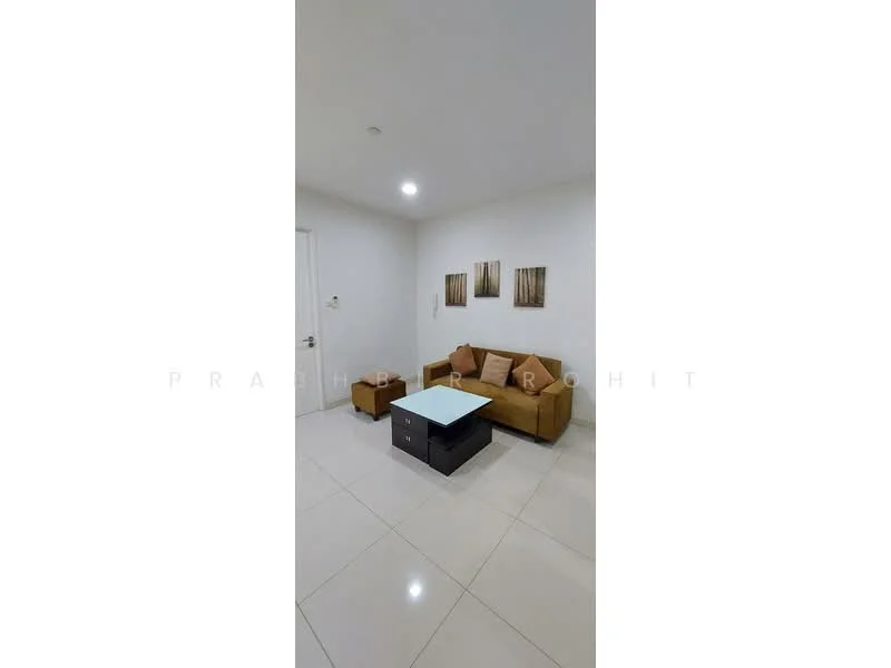 Living features: cream painted walls, white ceiling, recessed downlights, glossy white tile flooring, 3-seater fabric sofa in beige, 2 accent cushions, coffee table with glass top and storage, framed artwork on walls; style: modern.