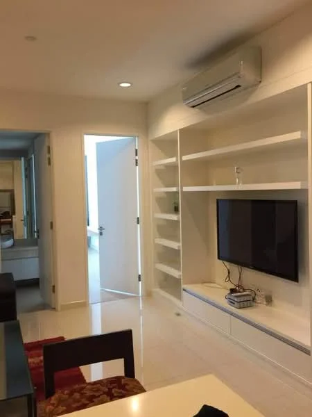 Living features: white painted walls, glossy tile flooring, wall-mounted TV, built-in shelving unit, 1 wall-mounted split AC, recessed downlights, open layout, doorway leading to another room; style: modern.