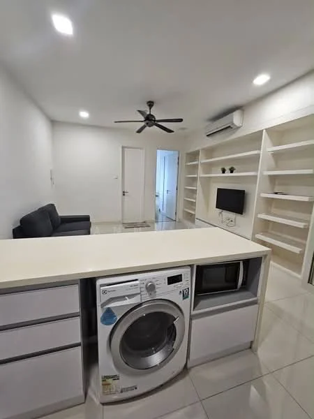 Room features: white painted walls, glossy tile flooring, 5-blade ceiling fan with light, wall-mounted air conditioning unit, sofa in dark grey, built-in shelving unit, microwave, front-load washing machine, kitchen island with storage, recessed LED downlights; style: modern.