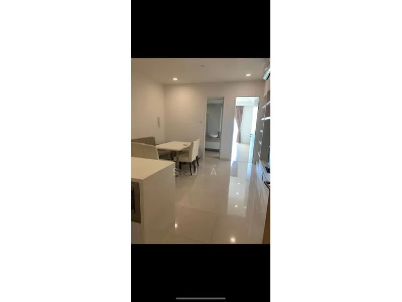 Room features: white painted walls, glossy tile flooring, recessed downlights, dining table with chairs, open layout, kitchen island, built-in shelving, doorway leading to another room; style: modern.