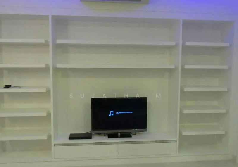 Living features: white built-in shelving unit, flat-screen TV, media console below TV, remote control on shelf, LED strip lighting above shelves, open shelving, minimalist design, neutral color scheme; style: modern.